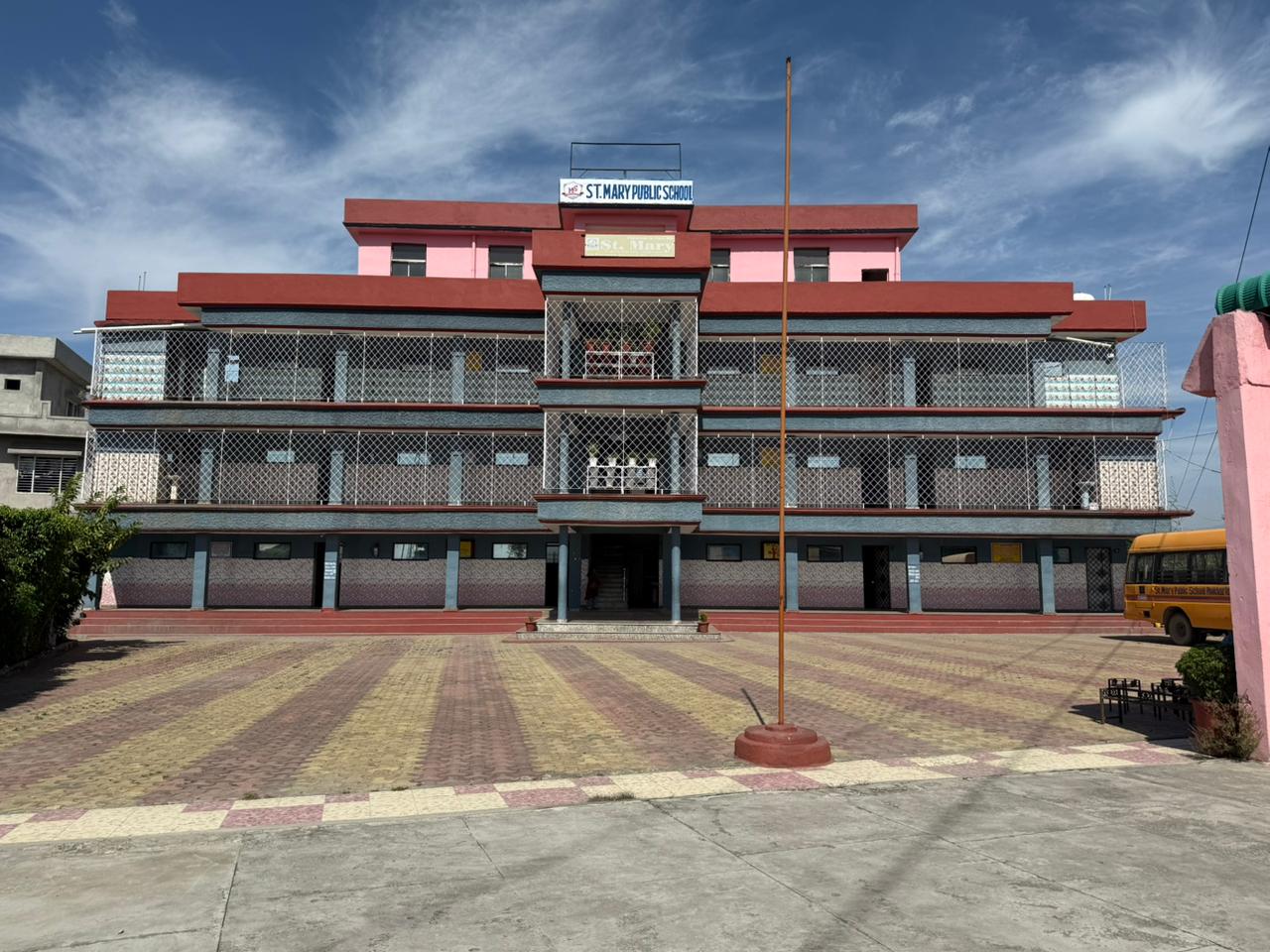 Wide view of the school building from the courtyard