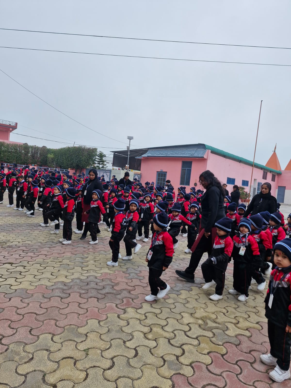 Young students standing in line during morning assembly