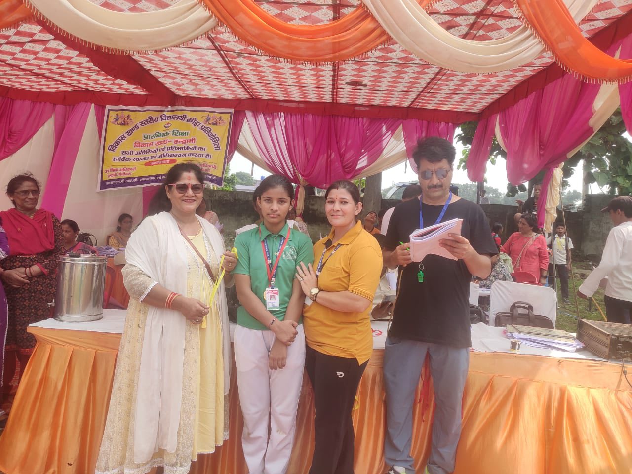 Student receiving a medal at the District level sports competition